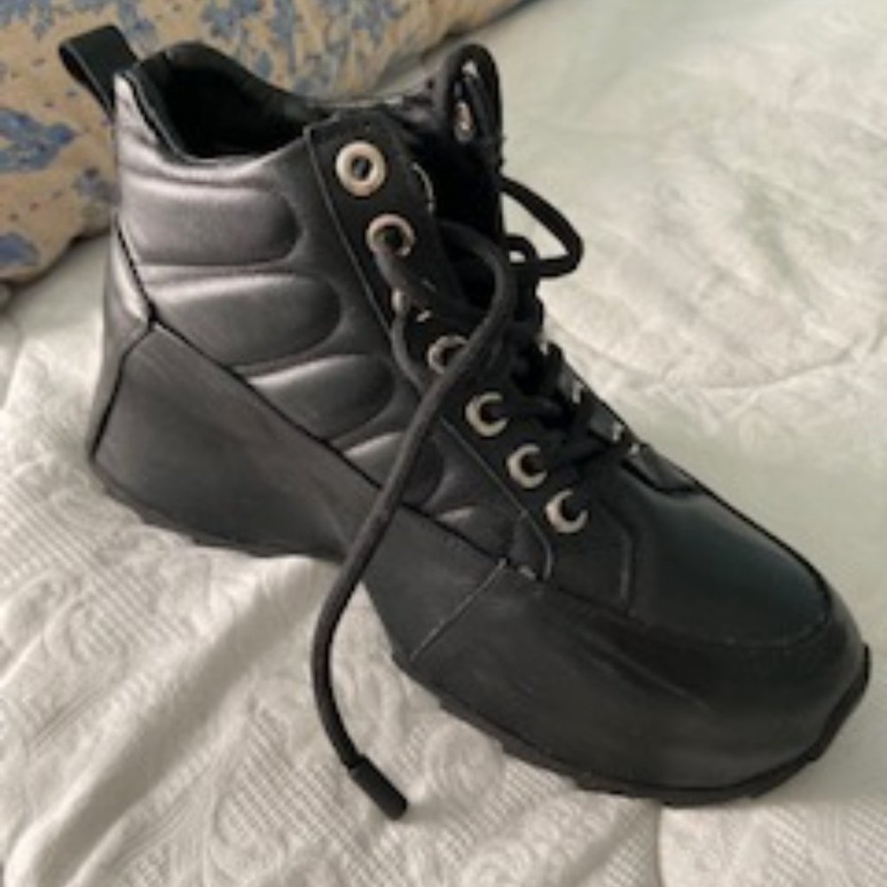Nila & Nila ITALIAN Leather and SHEARLING Ankle Boots from Net-a-Porter